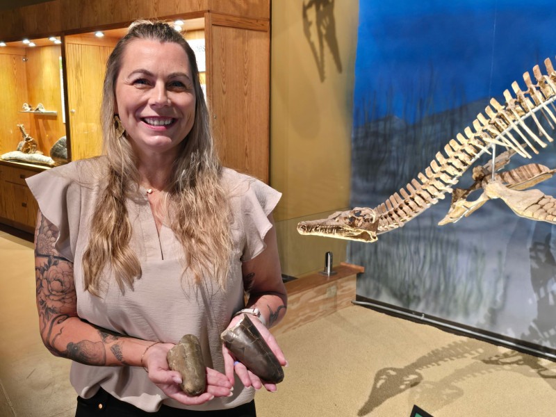 Palaeontologist Jessica Lippincott holding the two specimens.