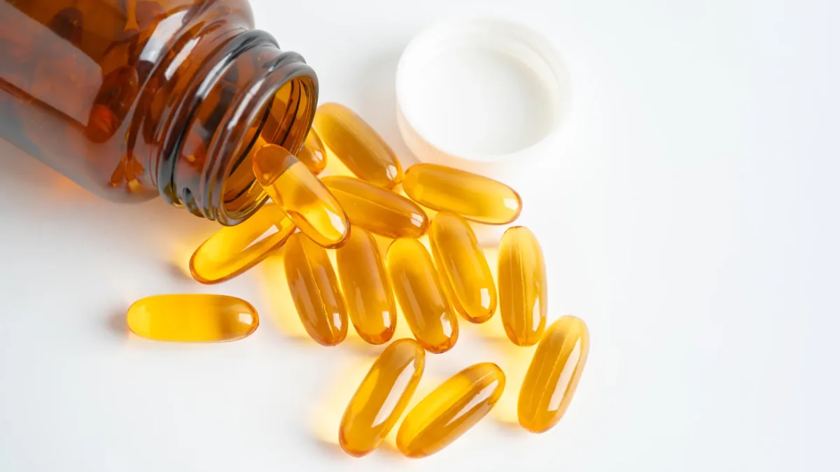 Fish-oil capsules used to illustrate DHA supplementation; not an endorsement or a photograph identifying the trial’s product.