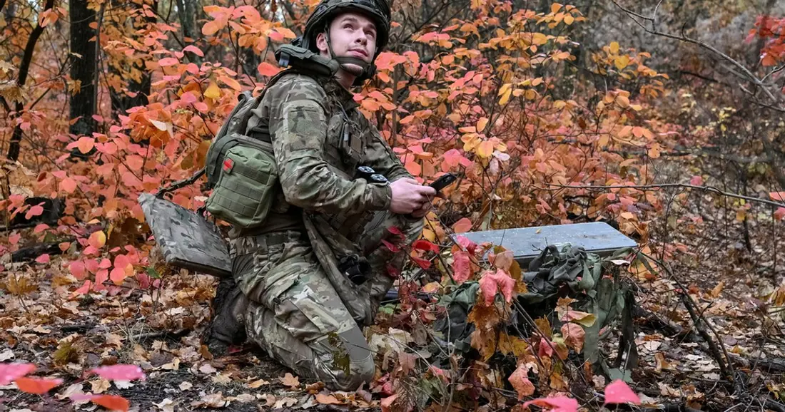 A Ukrainian artilleryman setting up Starlink; contextual photograph, not proof of a particular network speed.