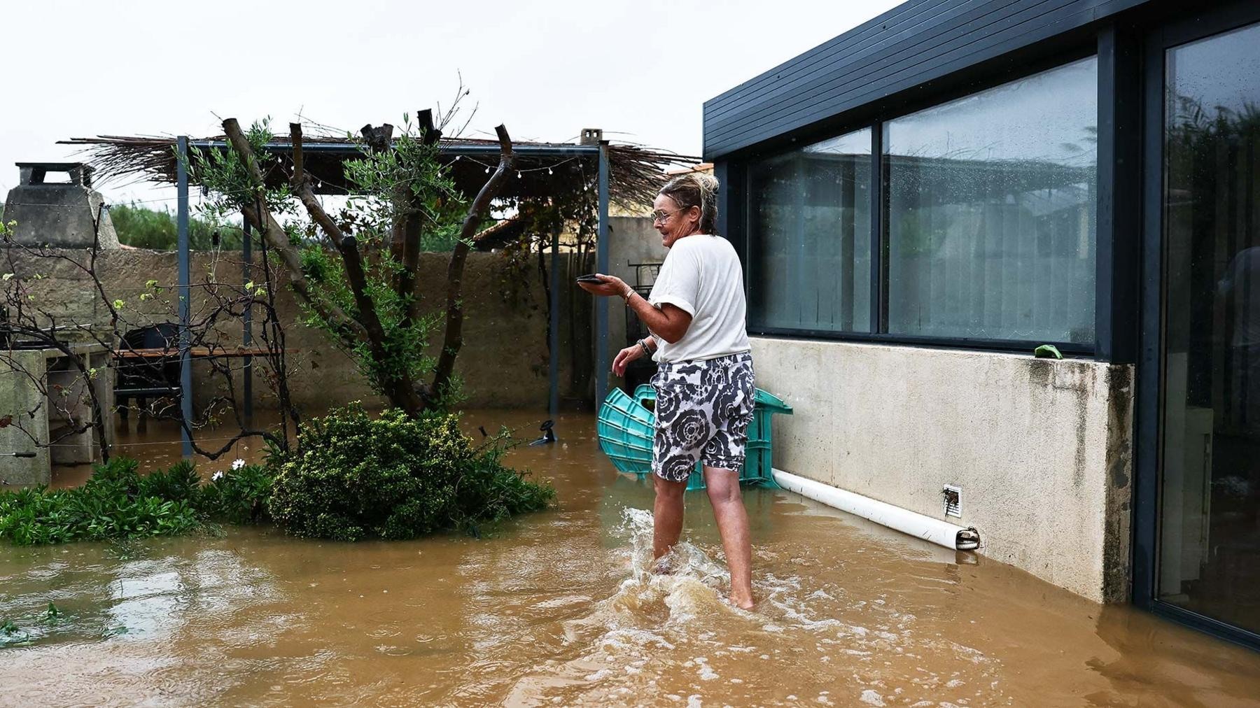A resident at a flooded home in Saint-Mitre-les-Remparts.